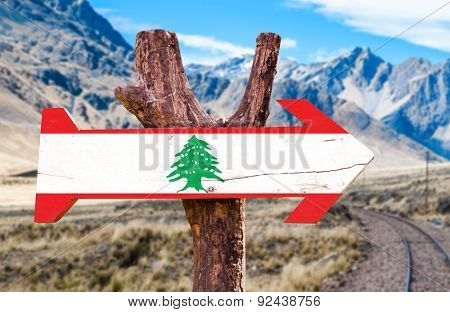Lebanon Flag wooden sign with desert road background