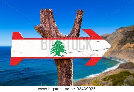 Lebanon Flag wooden sign with coast background