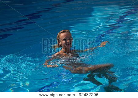 Sexy Girl In Bikini Swimms In Swimming Pool.