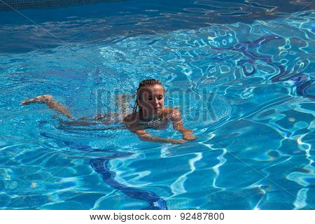 Sexy Girl In Bikini Swimms In Swimming Pool.
