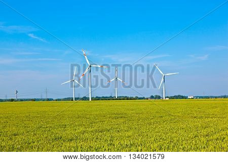 Wind Energy Wowers Standing In The Field In Spring