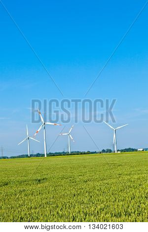 Wind Energy Wowers Standing In The Field In Spring