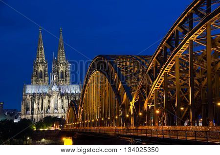 Photo of Cologne Cathedral and Hohenzollernbruecke at night
