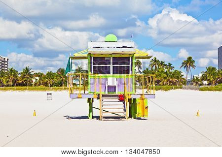 MIAMI, USA - JUNE 3, 2012: wooden colorful beach watch hut at the beautiful white beach
