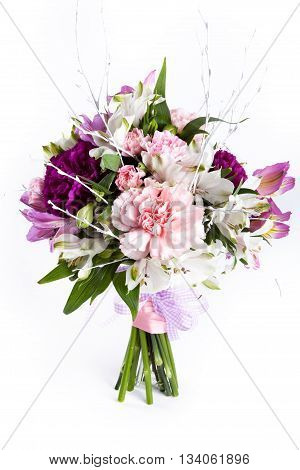 Pastel bouquet from pink and purple gillyflowers on white background