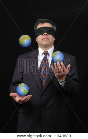  Businessman Juggling With Planet Earth