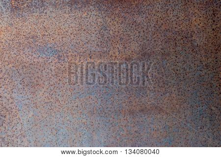 old brown rusty sheet of metal corrosion as a background