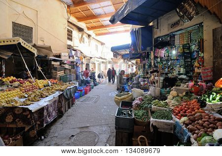 FES - MARCH 09: Arabic people at covered market (souk) in a city Fes in Morocco. Fes is a historic city listed in UNESCO. March 09, 2012 Fes, Morocco.