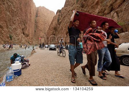 TODRA MOROCCO - AUGUST 02: Unidentified people in a canyon in Morocco August 02 2015. Todra Gorge is a canyon in the High Atlas Mountains in Morocco near the town of Tinerhir.