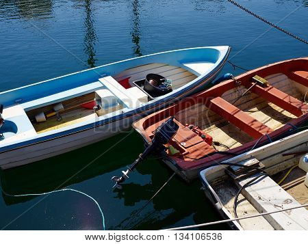 Typical traditional colorful small Danish fishing boat in a harbour at Funen Denmark