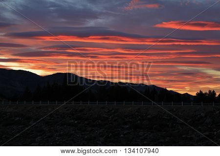 Sunrise in Hawea New Zealand. Dramatic morning sky.