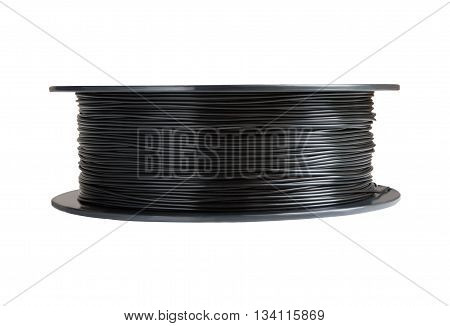 Filament for 3d printing. Black thermoplastic. Isolated on white background. Material produced from polylactic (pla) acid. One reels horizontal view. Macro, cutout. Concept of new technology for modeling and producing at home.
