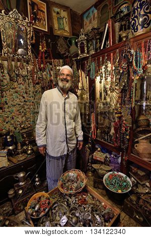 MARRAKESH - AUGUST 08: Unknown man in a market (souk) August 08 2015 in a Marrakesh Morocco. The traditional Berber market is one of the most important attractions of the city Marrakesh Morocco