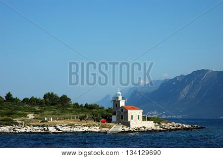 Seascape and lighthouse on the coast near Hvar island, Croatia