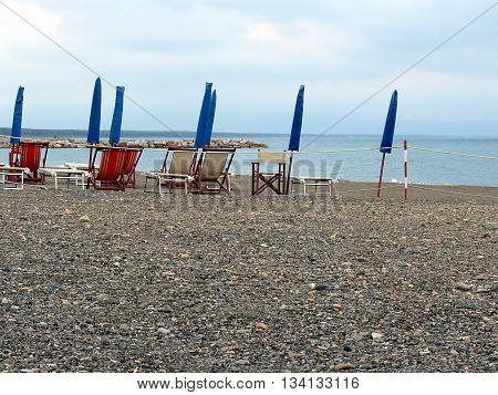 Beach umbrellas and chairs. Marina di Cecina Livorno Italy