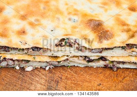 Cutting Bean Filled Bread (lobiani) Close Up