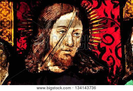 Triel sur Seine France - april 3 2016 : the Christ on historical stained glass window in Saint Martin church