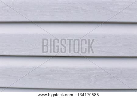 Background of Installed on the facade of house panels beige vinyl siding
