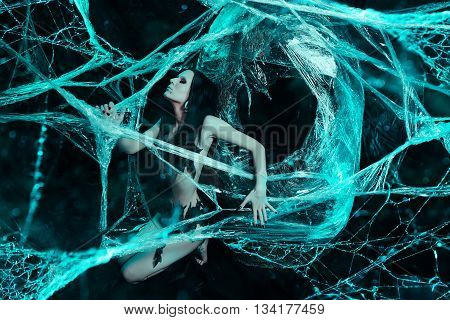 Girl like a spider getting out from the cocoon