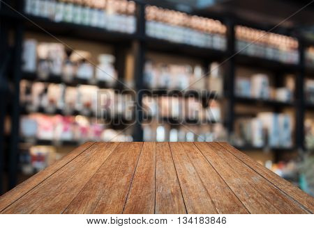 Perspective wooden with coffee shop blurred background with bokeh, stock photo