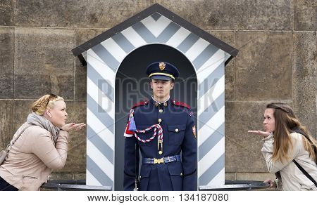 PRAGUE, CZECH REPUBLIC - JUNE 6, 2013:Girls send a kiss soldier