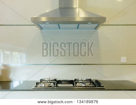 Cooking Gas Stove With Hood In Modern Kitchen