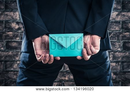 Has A Letter Man Wearing A Suit