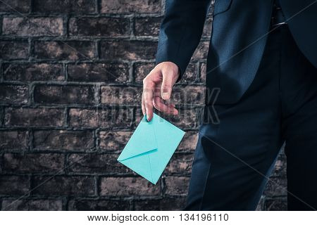 Has A Letter Man Wearing A Suit