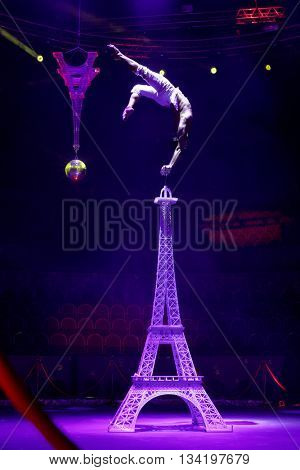 ST. PETERSBURG, RUSSIA - JUNE 2, 2016: Equilibrist Papin Khachatryan in the dress rehearsal of the Show of Water, Fire, And Light in the Ciniselli circus. This new show first time arrived in the city