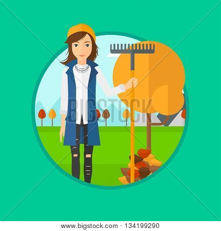 A woman raking autumn leaves. Woman with rake standing near tree and heap of autumn leaves. Woman tidying autumn leaves in garden. Vector flat design illustration in the circle isolated on background.