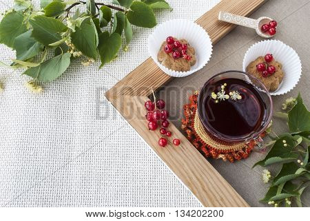 Cup of hot tea with delicious cookies selected