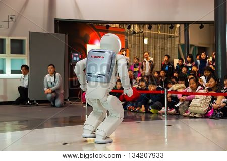 TOKYO JAPAN - NOVEMBER 27 2015: Asimo the humanoid robot created by Honda is presented at Miraikan The National Museum of Emerging Science and Innovation in Odaiba area