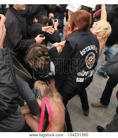 ISTANBUL,TURKEY-MARCH 8 :Ukrainian FEMEN activists were taken into custody when they attempted to stage nude demonstration in Istanbul on March 8,2012 in Istanbul,Turkey