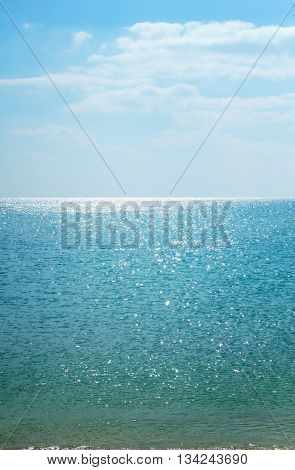 Beautiful seascape. Calm sea. Endless Ocean. Calm sea vertical background. Sunny day at sea. Sky and sea.