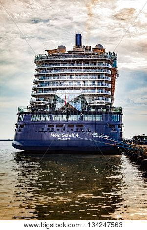 GDYNIA, POLAND - MAY 31, 2016: The magnificent luxury cruise ship the Mein Schiff 4 is docked at wharf in Port of Gdynia.