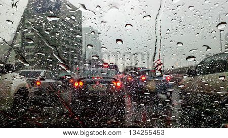 Rain on the street in the city. Raindrops falling on a glass droplets.