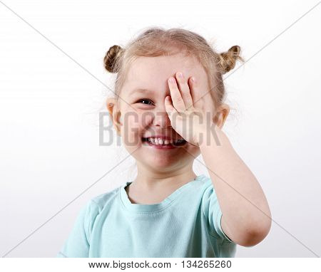 Kid Testing Vision. little girl closed one eye hand eye test