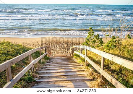 walkway lead beach wooden rough sea sunset