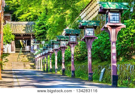 Alley of wooden lanterns at Chorakuji Temple in Kyoto, Japan