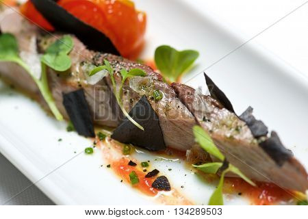 Typical tuna tapa in a small white dish.