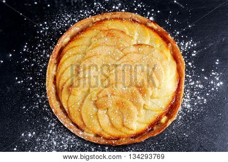Golden Bramley apple tart with cinnamon glaze.