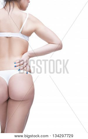 Back and buttocks. Beautiful female body with copy space. Isolated on white background