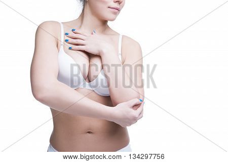 Young beautiful caucasian woman with large natural breasts. Copy space. Isolated on white background
