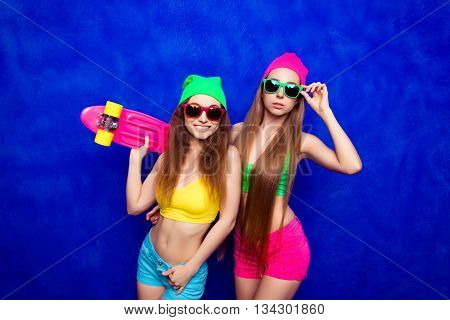 Smiling Sexy Skater Women In Hats And Glasses With Skate