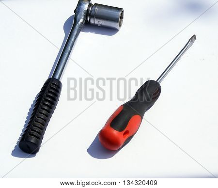 Screwdriver and ratchet wrench with white isolated background