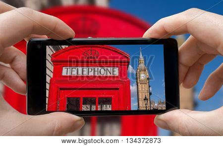 Tourist Is Taking Photo Of Red Phonebooth In London With Smartph
