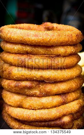 Fresh Nepali bread or Sel Roti on sell in the street of Nepal. It's a sweet bread made with rice flour.