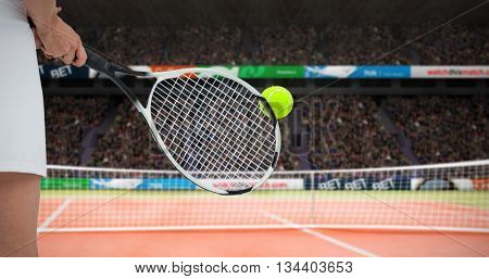 Athlete playing tennis with a racket against facing view of net on tennis field