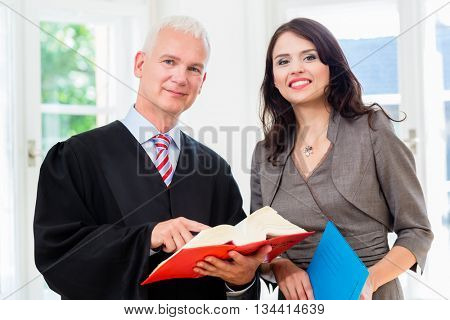 Lawyer and paralegal in their law office
