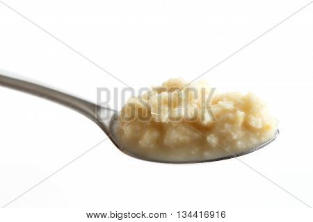 Spoon Of Horseradish Sauce In Perspective Isolated On White.
